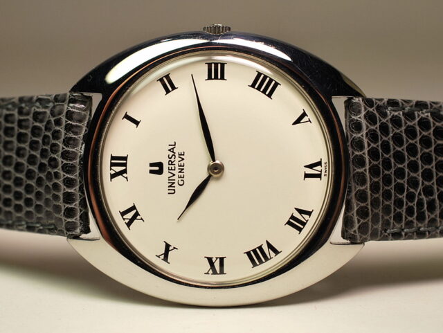 ( SOLD IN SOUTH COREA ) UNIVERSAL GENEVE elegant steel watch - elliptical case - STORAGE of the 70s with box and warranty