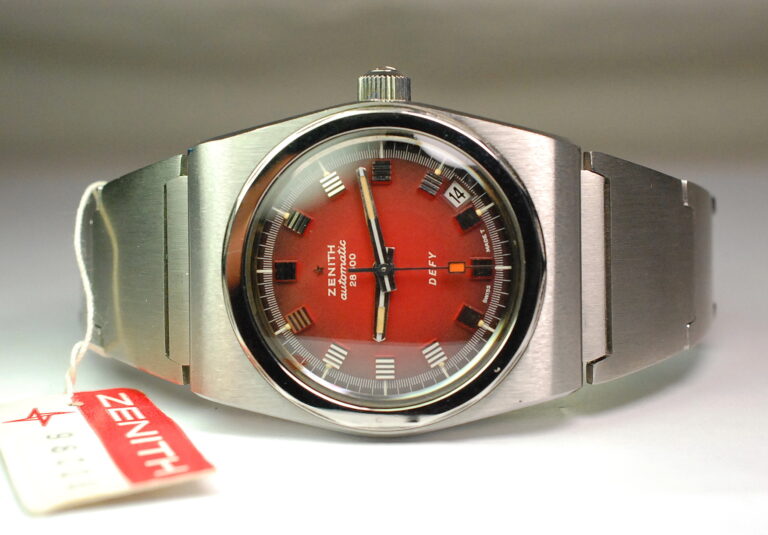 ( VENDUTO NEL REGNO UNITO ) ZENITH DEFY ref. A7682 quadrante rosso - bracciale Gay Freres - RIMANENZA DI MAGAZZINO con plastiche protettive originali