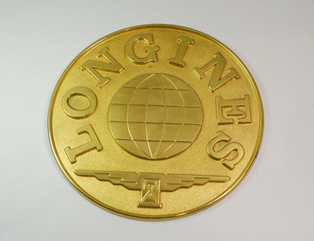 LONGINES insegna da vetrina per concessionari ufficiali - in metallo dorato - anni '70 / '80