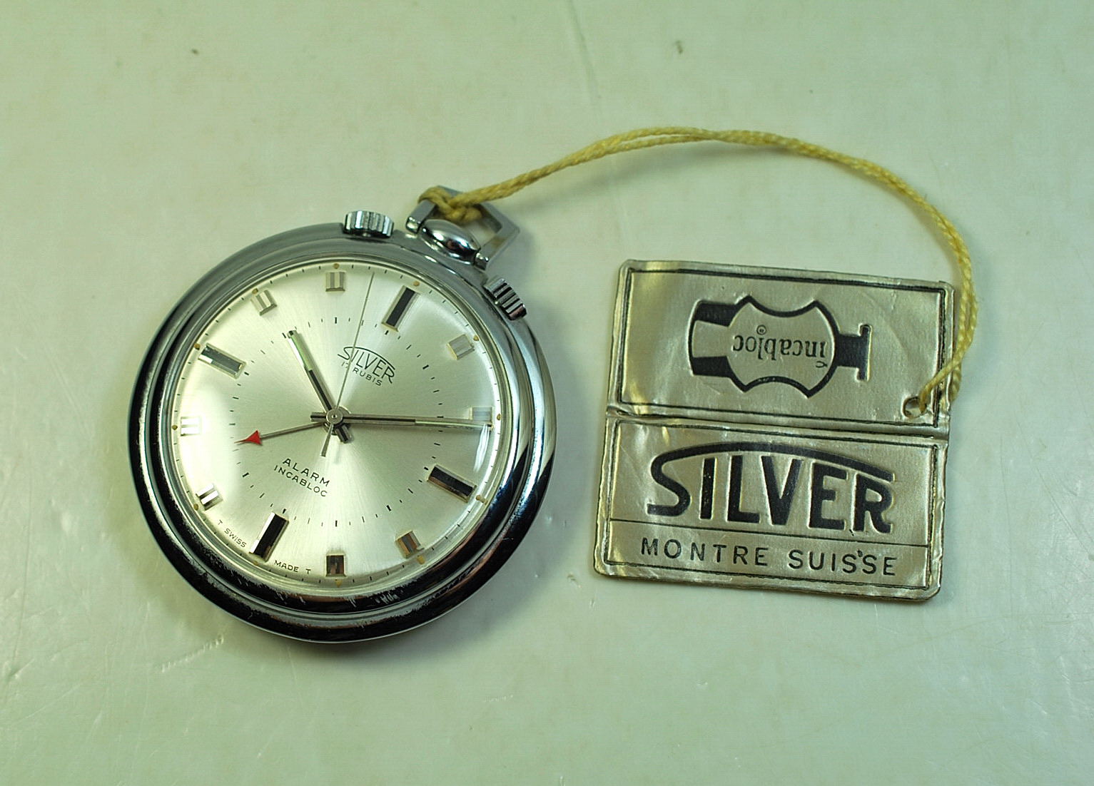 Digital pocket watch with alarm clearance