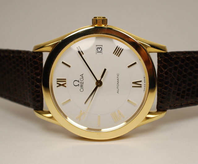 ( SOLD ) OMEGA automatic - reference 166.0295 elegant men's watch from the 90s with 18k (750/°°) yellow gold case in exceptional condition