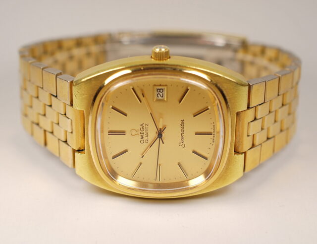 ( SOLD IN CANADA ) Omega Seamaster QUARTZ - reference 196.0085 men's watch from the 1970s with yellow gold plated metal case and bracelet